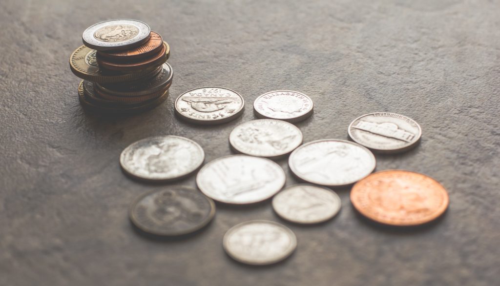 selection of stacked foreign coins