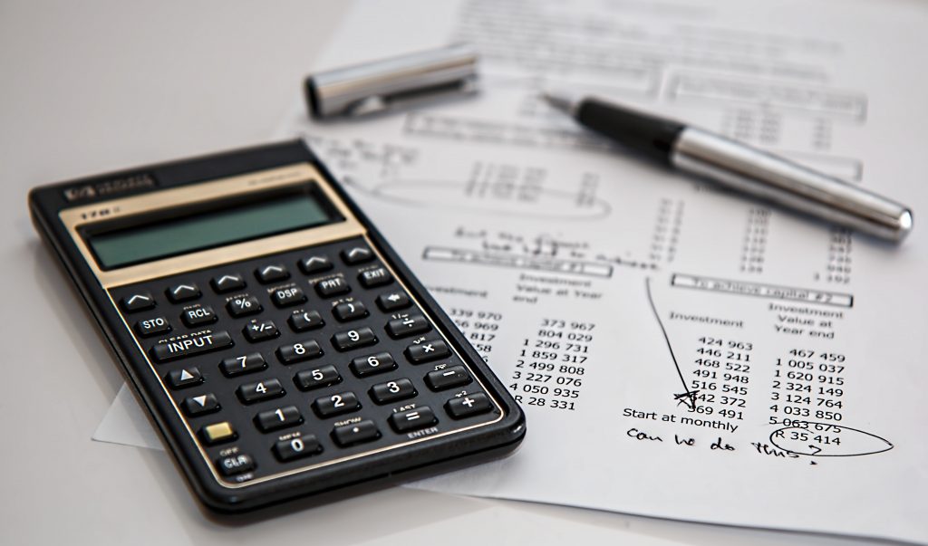 calculator ontop of financial document on table
